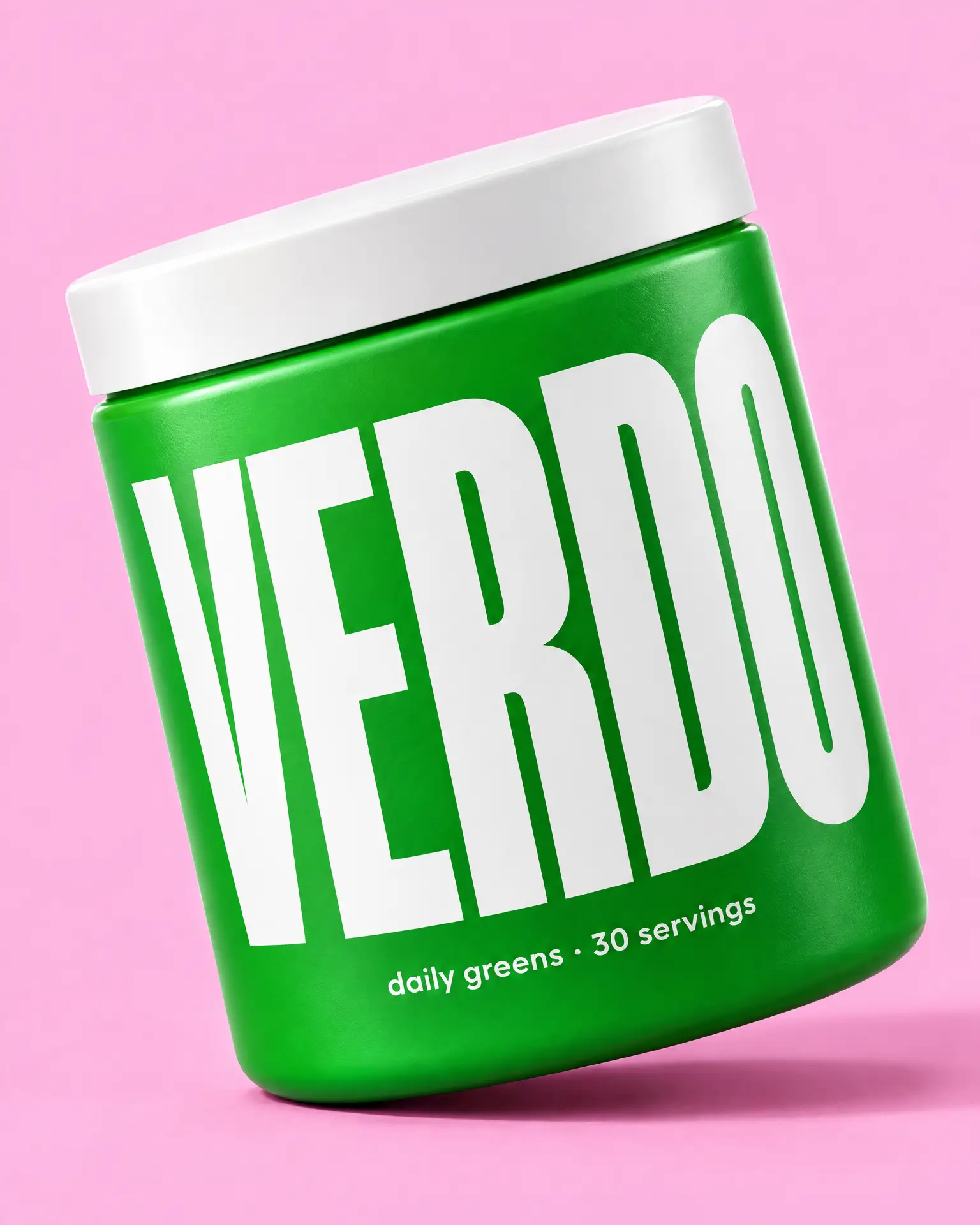 A bright green Verdo greens tub tilted on candy pink.